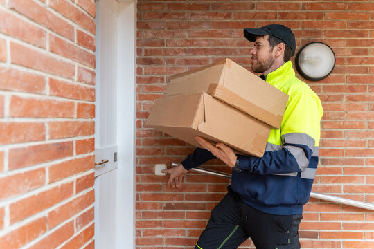 Delivery Worker Brings Packages to a Door