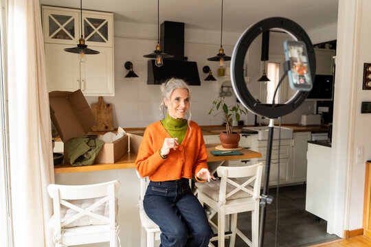 Senior woman live streaming fashion