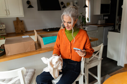 Senior woman reviewing clothing