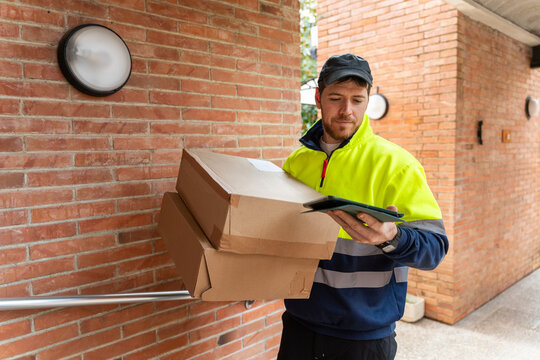 Delivery worker confirming order tablet