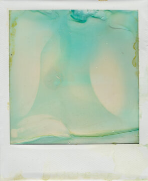 Abstract textured background of a deteriorated instant film