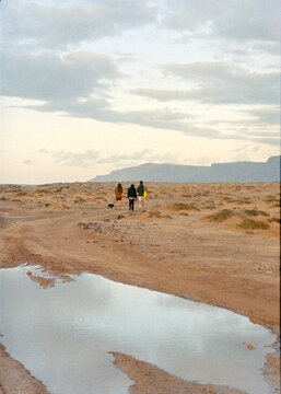 Long film shot of a group of friends enjoying a walk