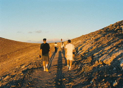 Film shot of a group of friends enjoying a walk in an arid landscape