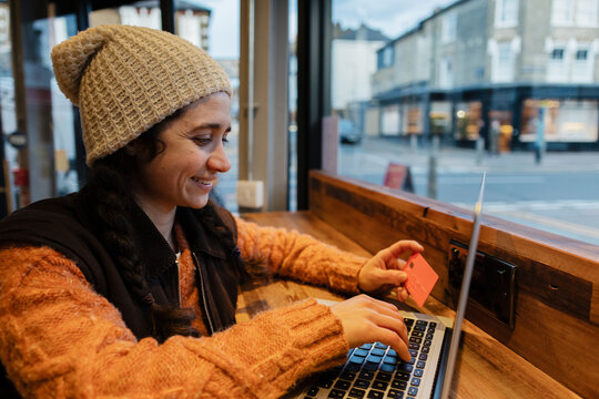 Woman shopping online with credit card