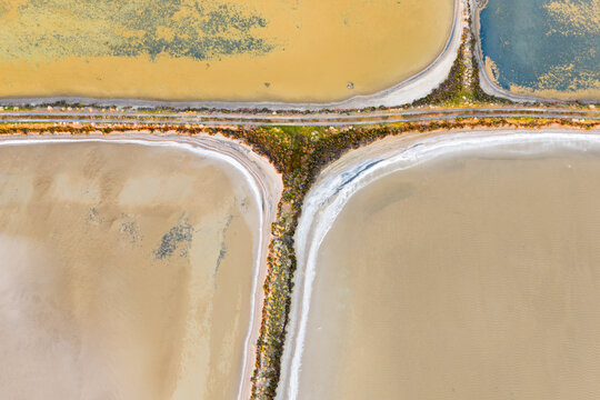 Patterns and levee banks in a colorful drying salt lake