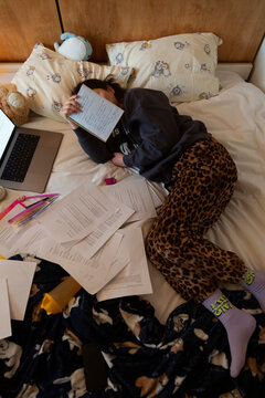 Student sleeping exhausted after long study session