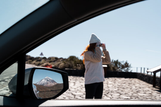 Woman photographing Teide viewpoint