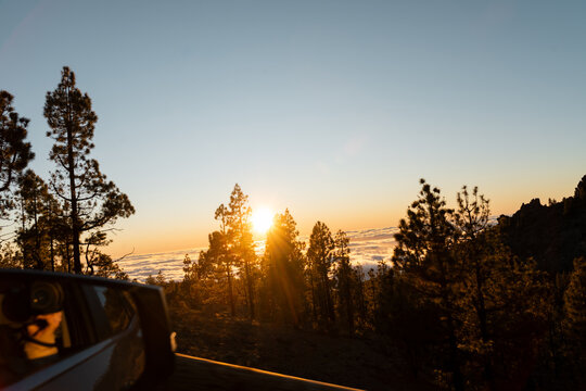 Car sunset sea clouds
