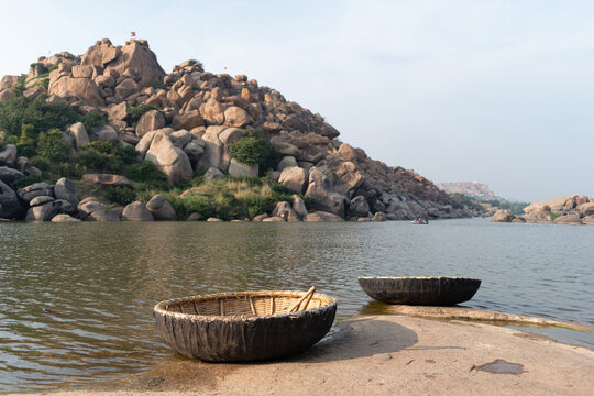 Traditional coracle boats on river in Hampi, India