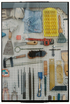 Colorful tool display on pegboard on 35 mm film