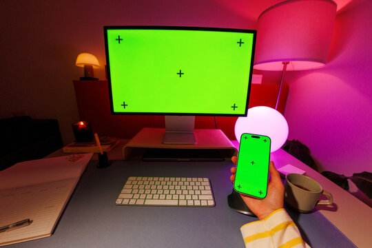 phone and computer mockup with green screen workspace
