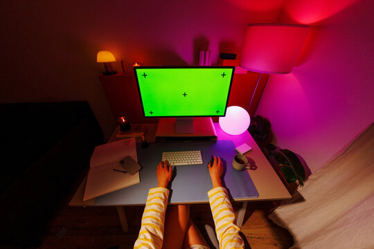 Business woman working at computer in vibrant office space