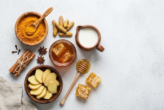 Golden milk ingredients including turmeric cinnamon honey and milk