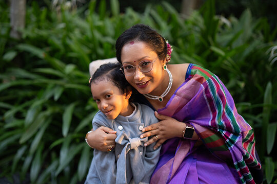 Indian mother with her cute daughter at outdoors
