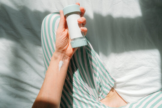 Woman Applying Compounded Topical Testosterone Cream  