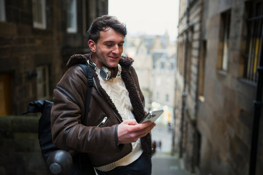 Man on phone in city
