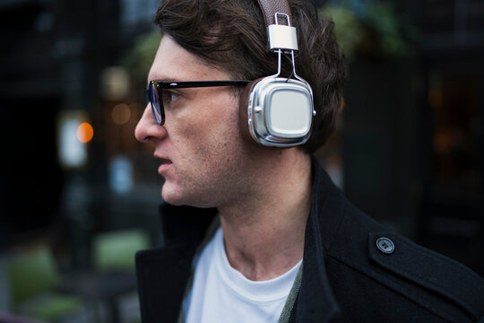 Man listens to music on street
