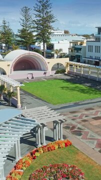 A scenic aerial view of the Napier Soundshell and gardens in Napier, New Zealand. The open-air venue is a popular spot for events and gatherings. Marine Parade.