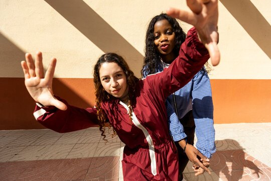 Two friends posing while dancing hiphop on the street