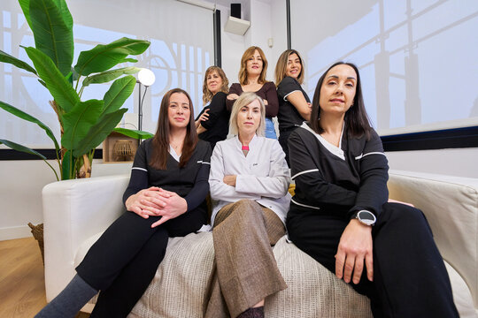 Female professionals team posing in beauty salon