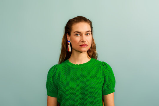 Model Poses Against a Blue Background 