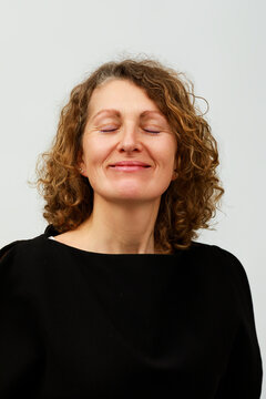 Woman Sitting and Relaxing With Eyes Closed 