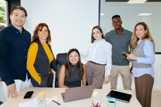 Diverse startup team collaborating in modern office environment