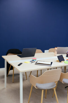 Modern meeting room interior with laptops and stationery