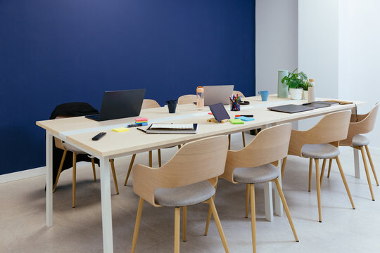 Modern coworking office space with blue wall
