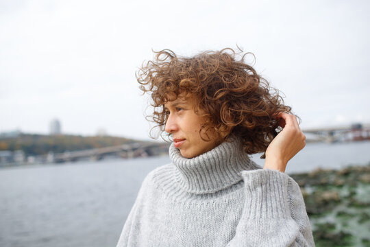 woman walking by the water