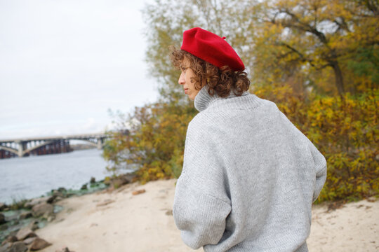 woman walking by the water