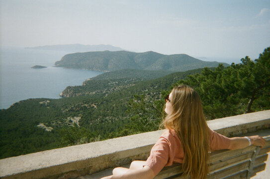 Woman Enjoys View of Mountains and Sea In Rhodes, Greece