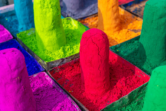 Gulal colored powder pigments for Holi festival in metal trays