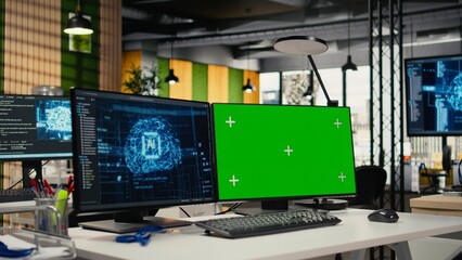Fototapeta premium Green screen PC in empty startup office with artificial intelligence program running on monitors. Mockup computers in AI industry startup workspace leveraging deep learning tech enhancing automation