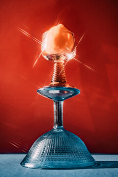 Glass with a bright object on top creates a striking display