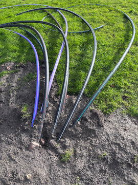 Curved Irrigation Tubing Laid Out On Lawn