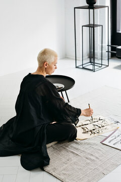 Creative Artist Captures Beauty Through Ink in Modern Studio