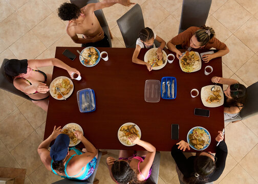 Family enjoying vacation meal together at dining table