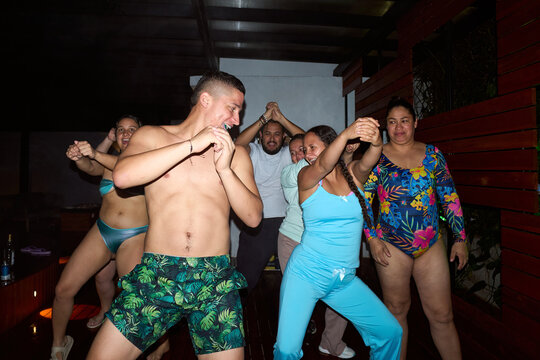 Group of friends dancing enjoying night party