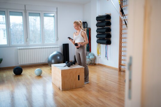 Woman training in modern gym space
