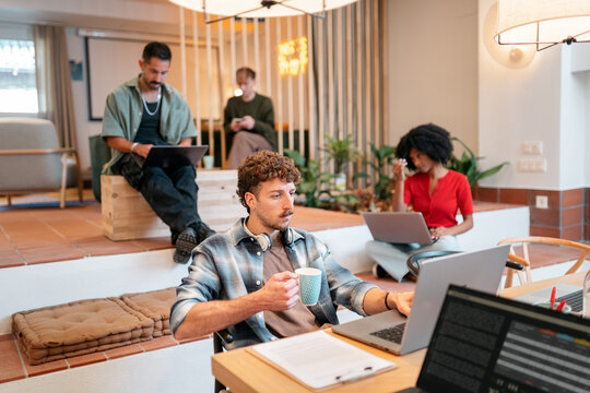 Diverse team collaborating in a modern coworking space