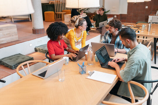 Diverse team collaborating in a modern coworking space