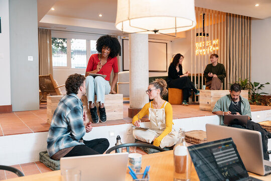 Diverse team collaborating in a modern coworking space