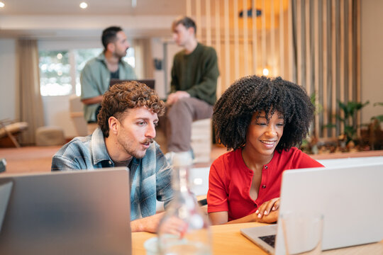 Diverse team collaborating in a modern coworking space