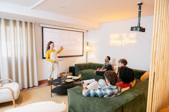 Young woman presenting business data to colleagues