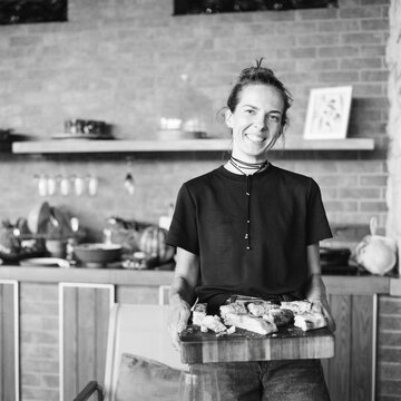 Woman Serving Freshly Baked Focaccia at Home