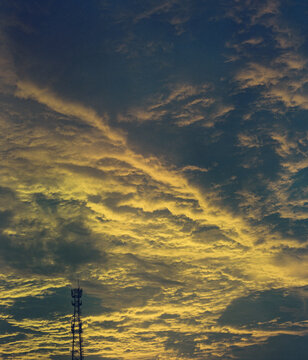 Golden Storm Clouds Above a Radio Tower