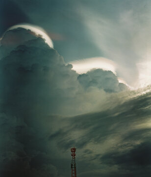 Communication Tower Beneath Dramatic Storm Clouds