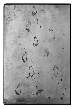 Barefoot Footprints on Concrete Surface