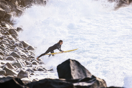 Surfer Diving Into Breaking Waves
